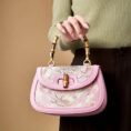 Song-Brocade-Pink-Mulberry-Silk-Handbag-Bamboo-Handle-Model-Holding