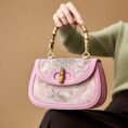 Song-Brocade-Pink-Mulberry-Silk-Handbag-Bamboo-Handle-Model-Seated