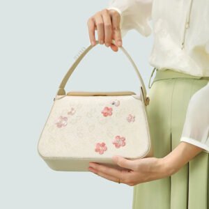 model-hand-holding-plum-blossom-bag