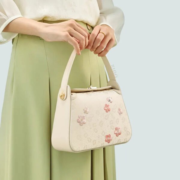 model-holding-plum-blossom-bag-both-hands-front model-holding-plum-blossom-bag-both-hands-front