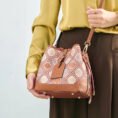 model-wearing-brocade-bucket-bag-crossbody